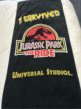 vintage 1990s Jurassic Park The Ride beach towel featuring the iconic movie logo